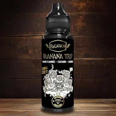 Bouteille de e-liquide Religion Baanana Trip King Edition 100ml sur fond bois sombre
