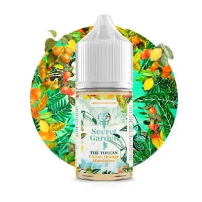 Flacon e-liquide The Toucan Secret Garden entouré de fruits exotiques et feuilles tropicales