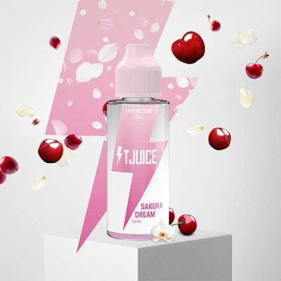 Bouteille TJuice Sakura Dream entourée de cerises et pétales, fond rose éclair